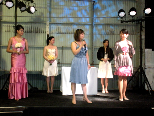 Demonstrations were ongoing. Here, Judy Lee of Iridescence Bridal Couture discusses a bridesmaids' dress styling